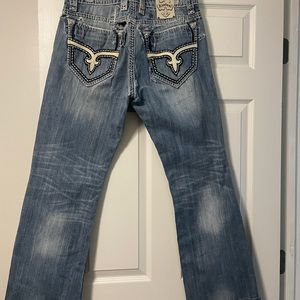 Great pair of SUPER DISTRESSED Rock Revival jeans